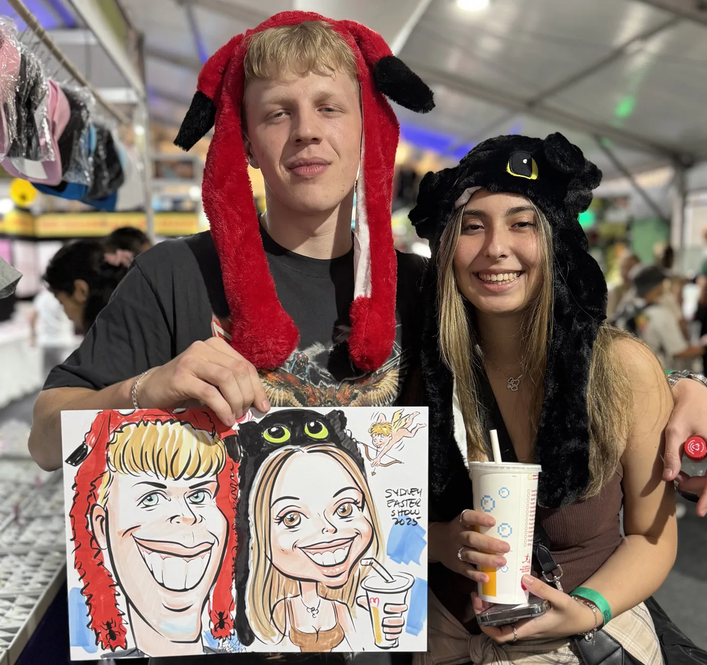 Person holding a hand-drawn caricature