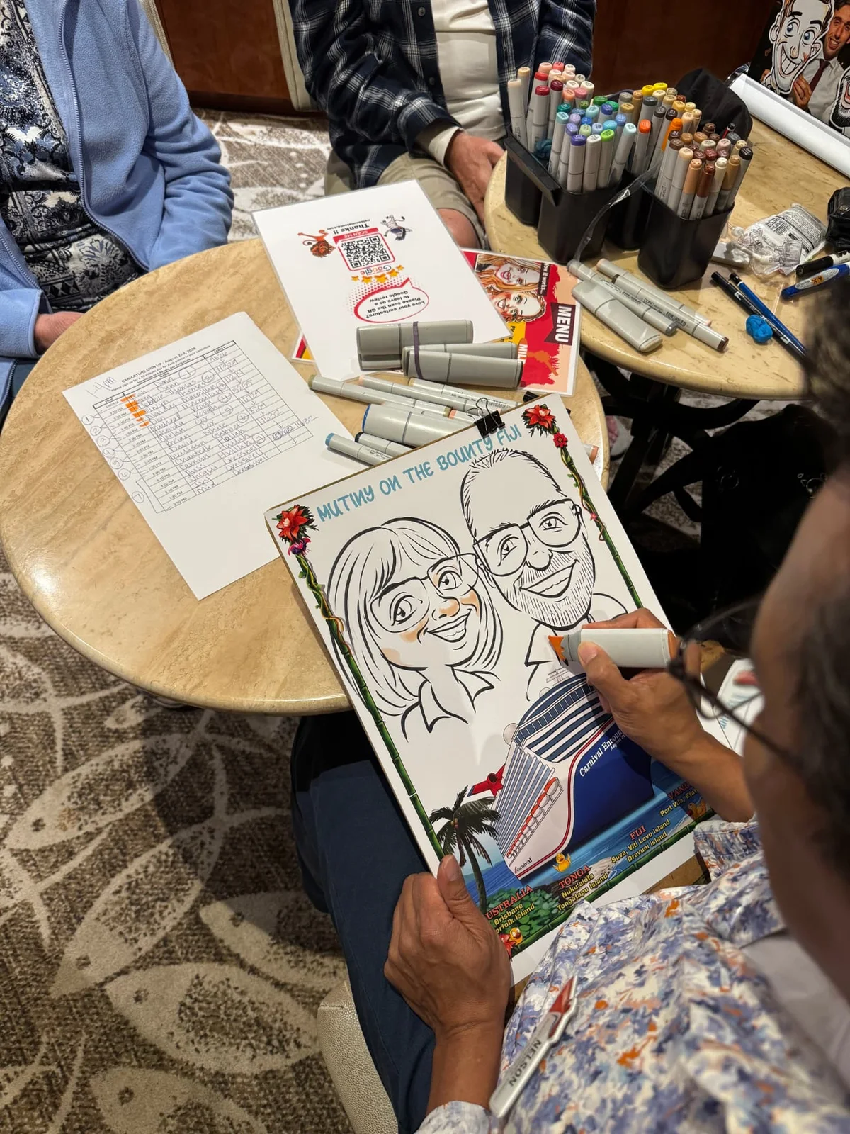A live caricature being drawn