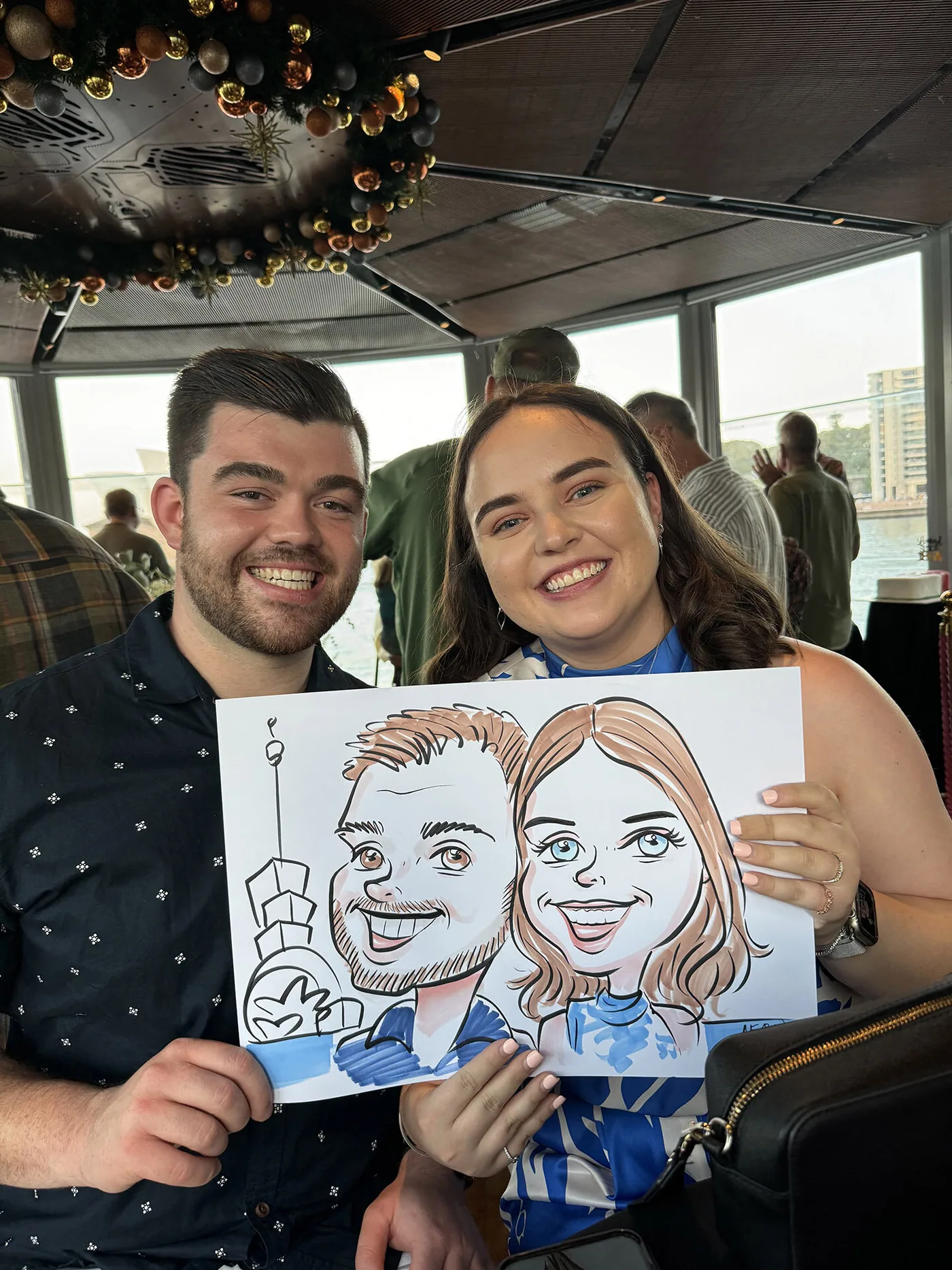 Person holding a hand-drawn caricature