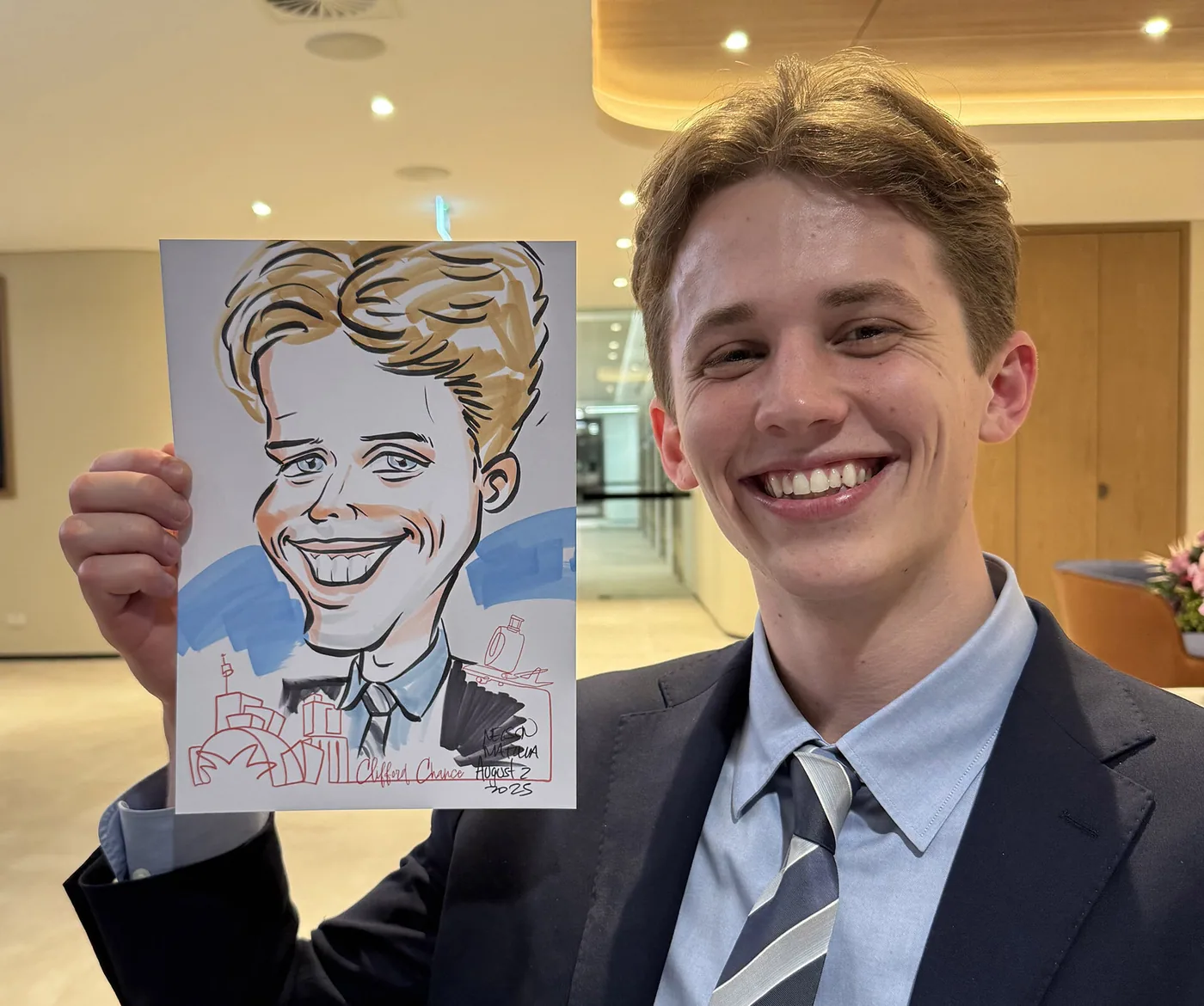 Person holding a hand-drawn caricature