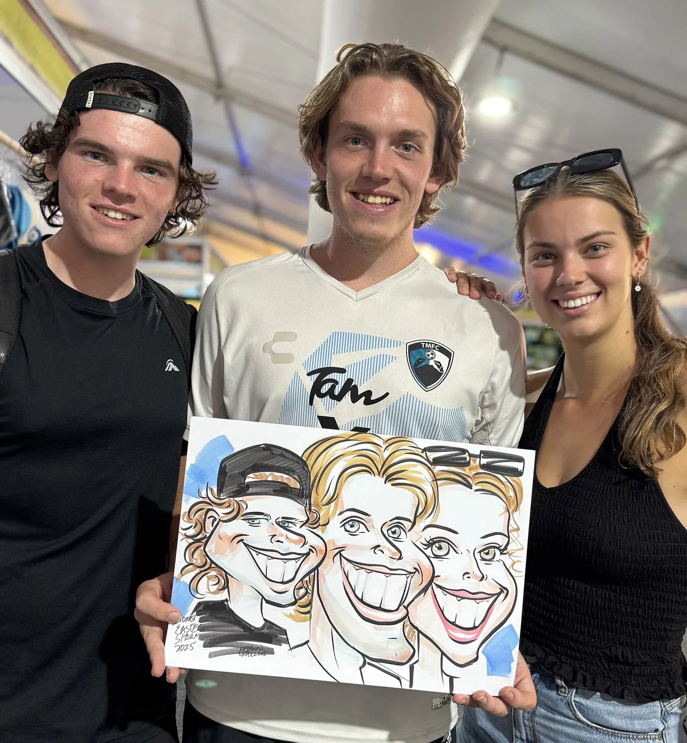 Person holding a hand-drawn caricature