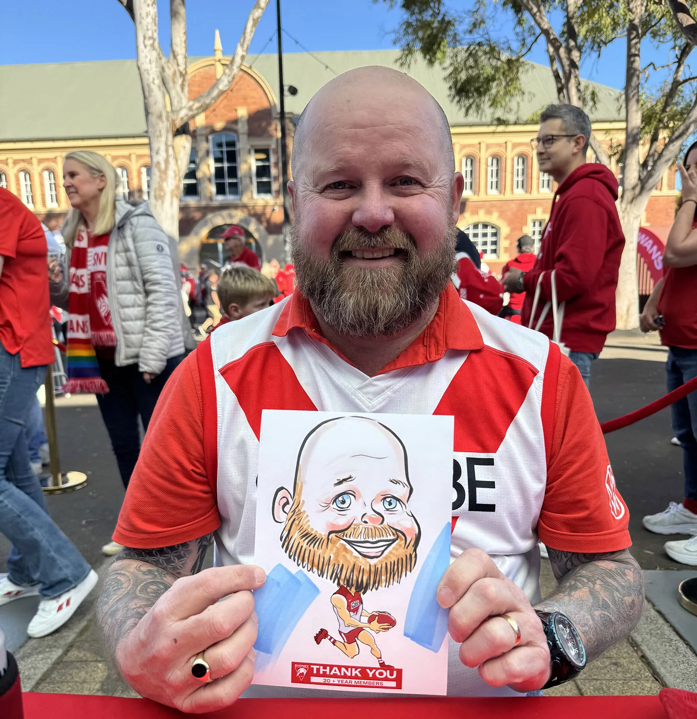 Person holding a hand-drawn caricature