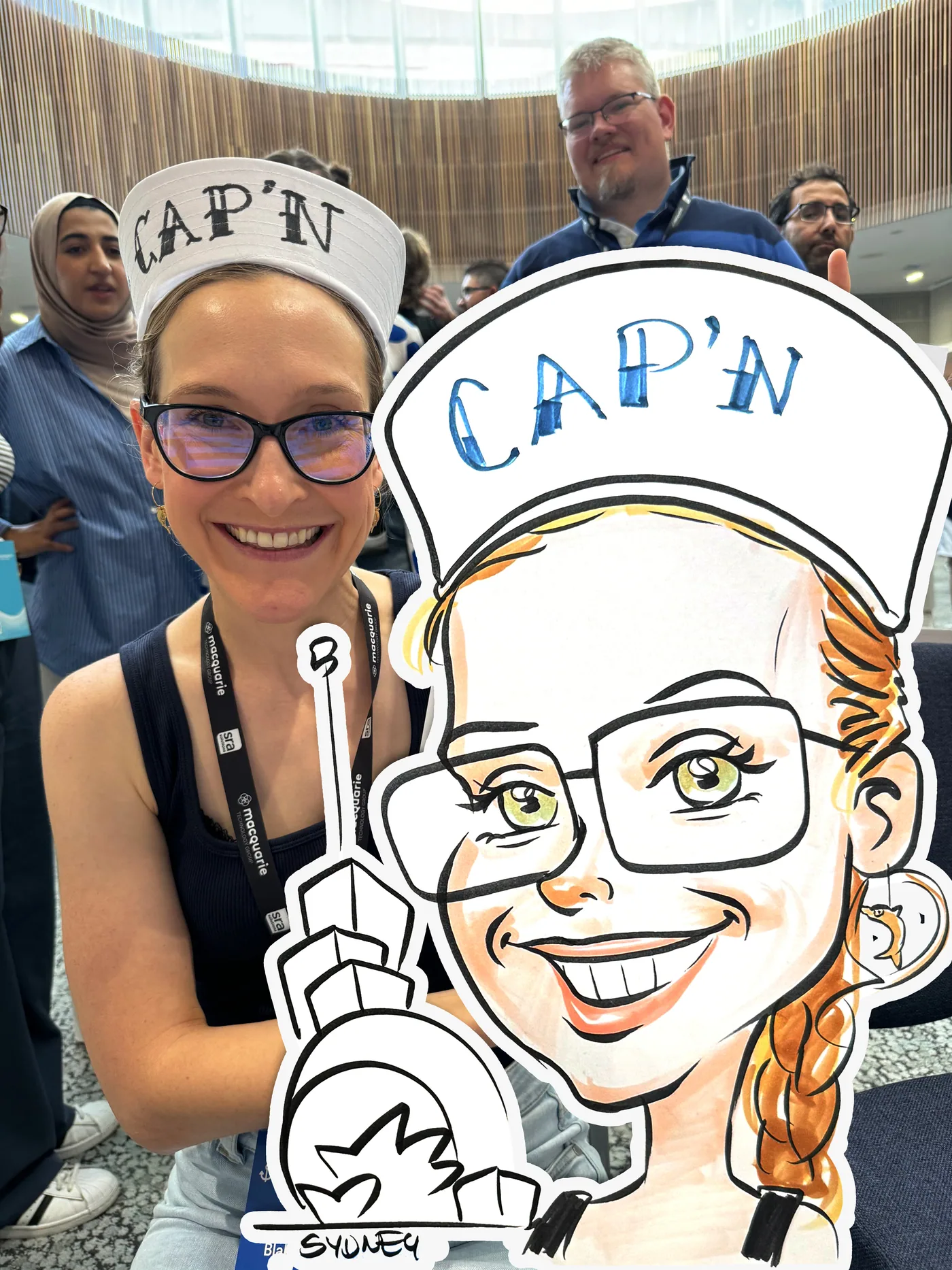 Person holding a hand-drawn caricature