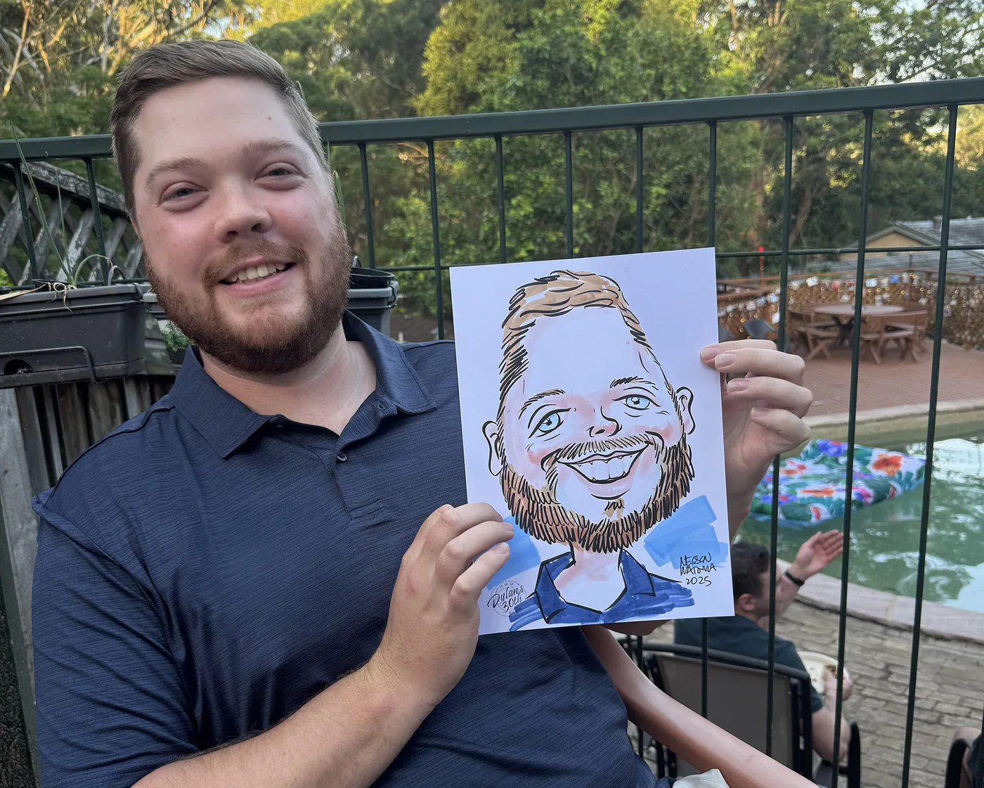 Person holding a hand-drawn caricature