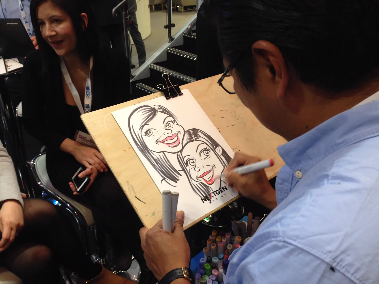 Nelson drawing a guest at an event
