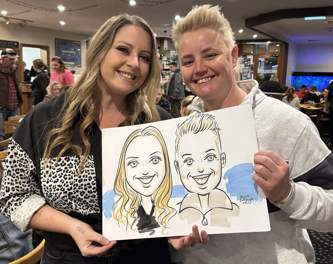Person holding a hand-drawn caricature
