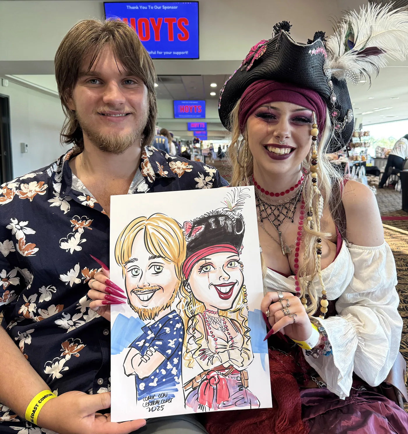 Person holding a hand-drawn caricature