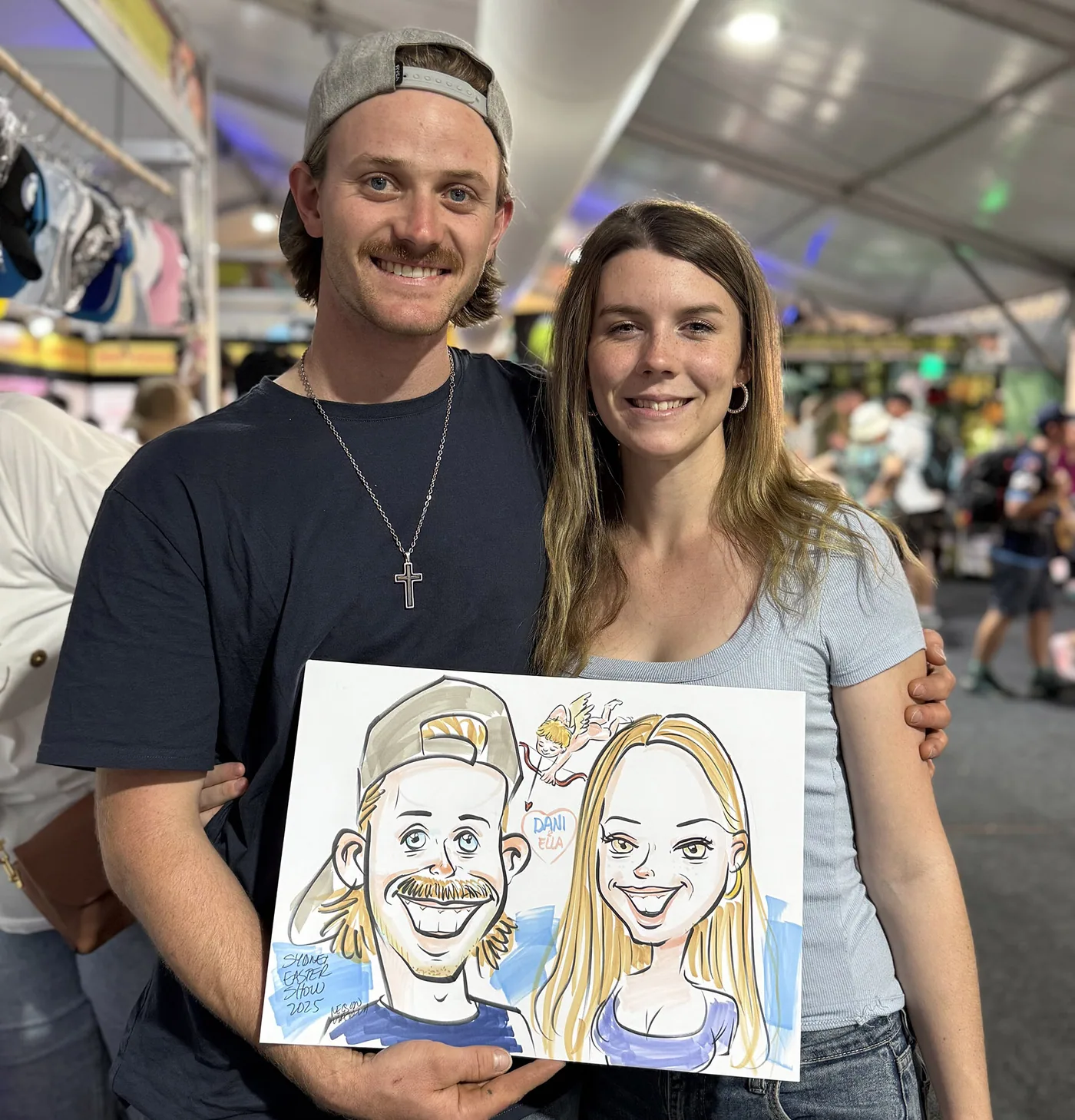 Person holding a hand-drawn caricature