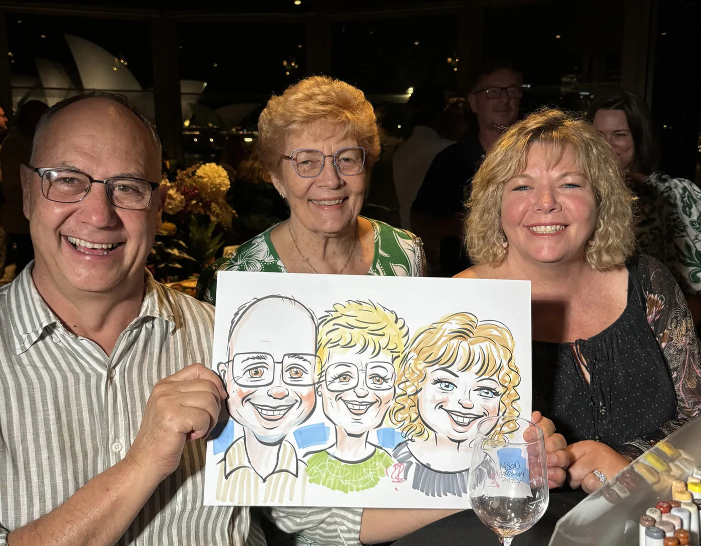 Person holding a hand-drawn caricature