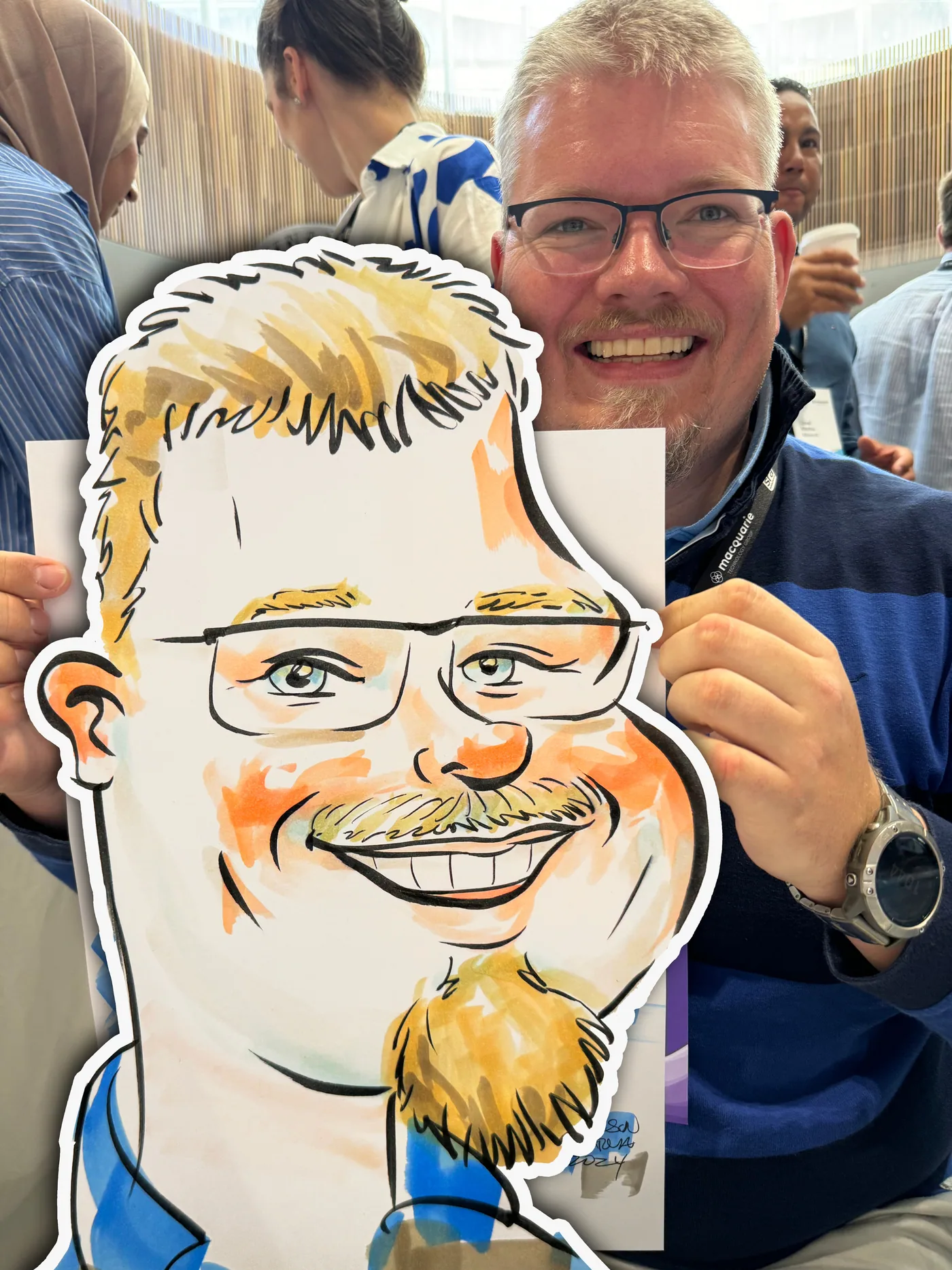 Person holding a hand-drawn caricature