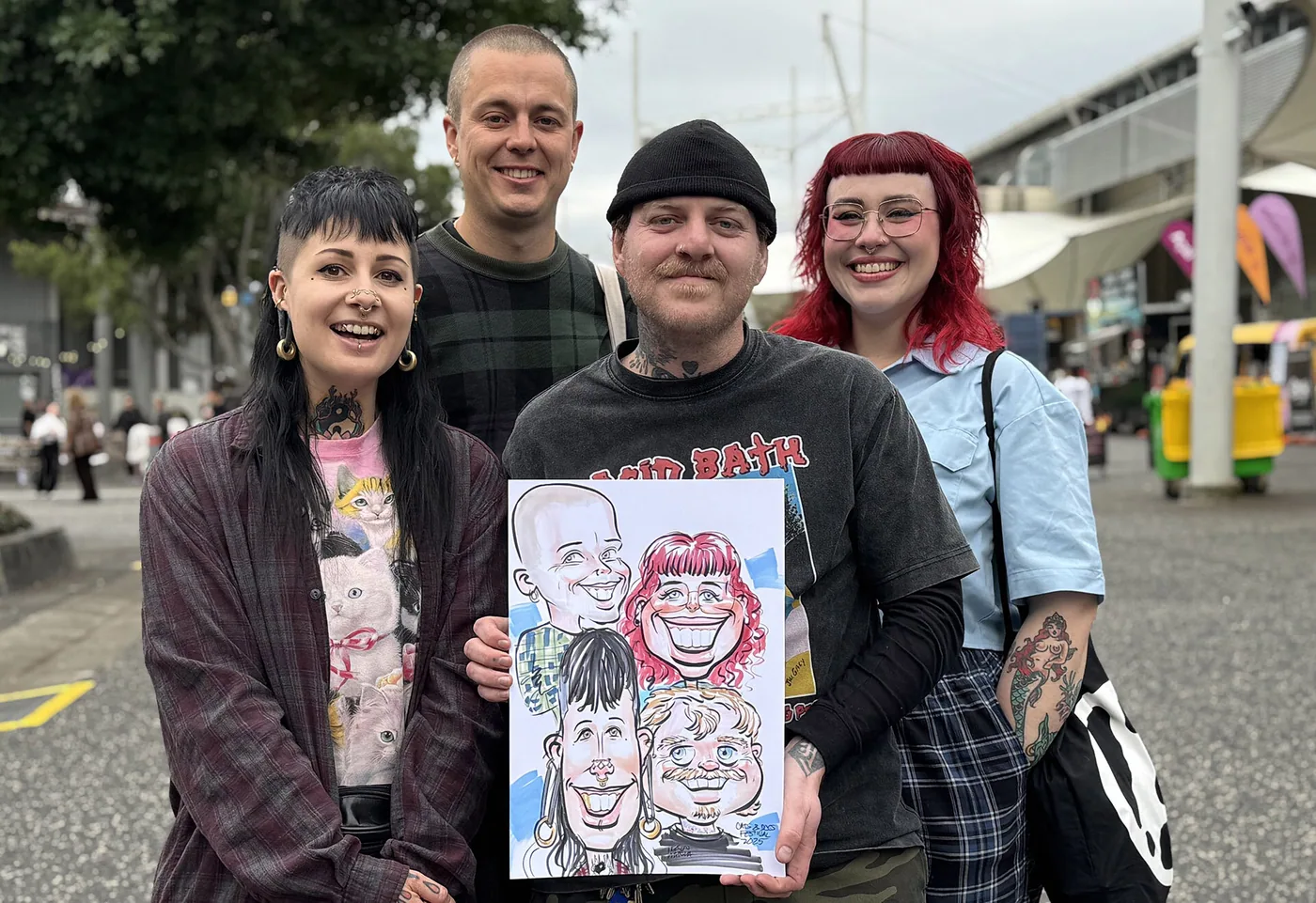 Person holding a hand-drawn caricature