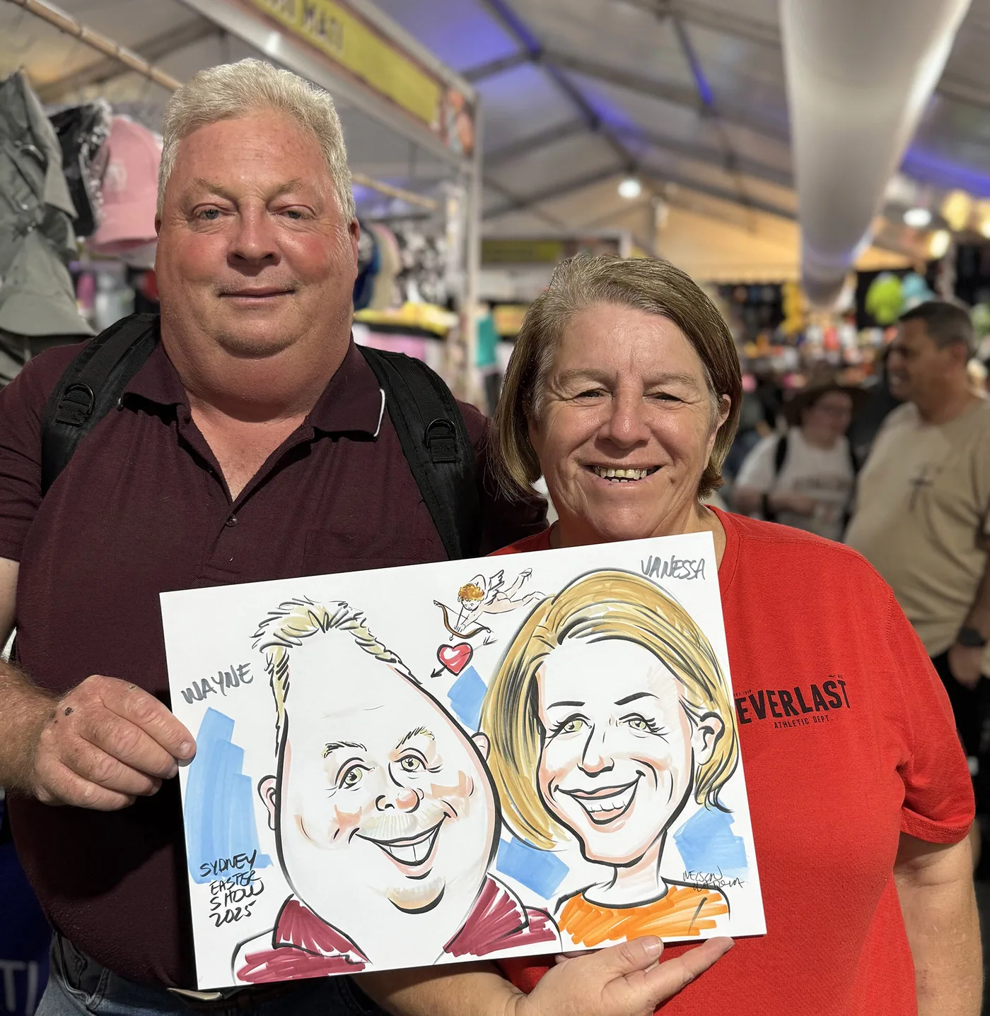 Person holding a hand-drawn caricature